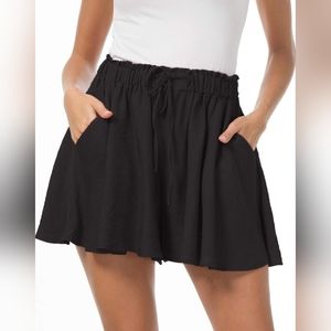 Black Flowy Elastic Waist Shorts with Pockets and Drawstring.